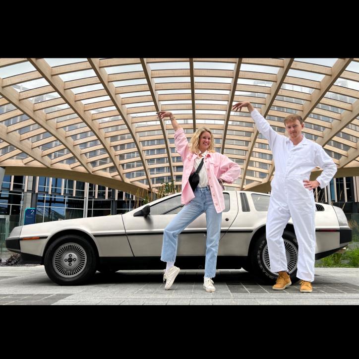 Jennifer Parker (Emilee) and Doc Brown (George) strike a pose with the DeLorean in front of Pioneer Group's beautiful atrium.