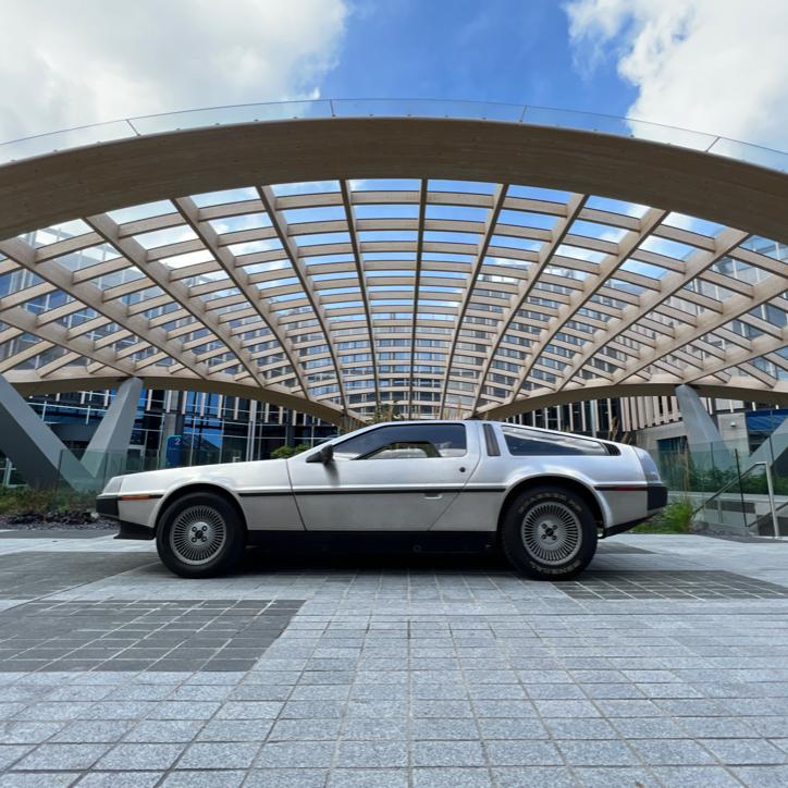 Now that's a view. The DeLorean posing outside the Pioneer Group's stunning atrium.