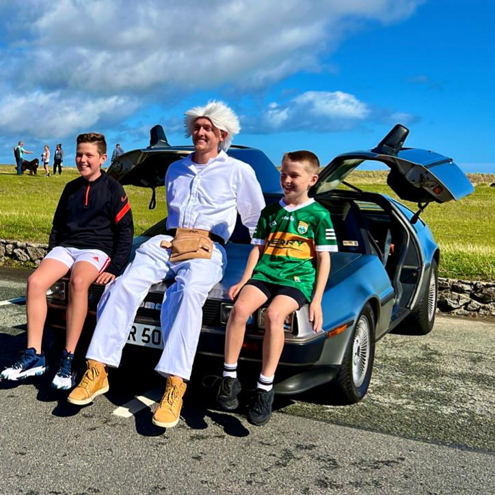 The DeLorean — and Doc Brown — hang with some fans.