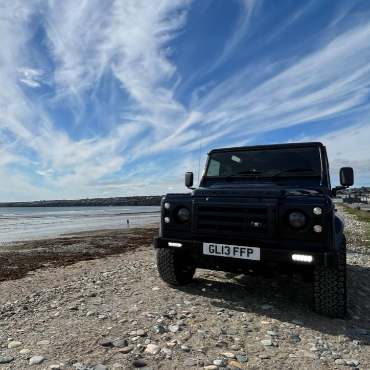 The Land Rover contemplates a dip at Guillamene Swimming Cove in Waterford.