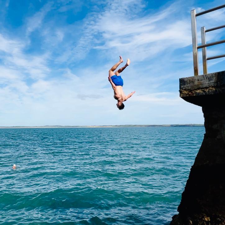 And, action: a local swimmer does a double back flip at Guillamene Swimming Cove.