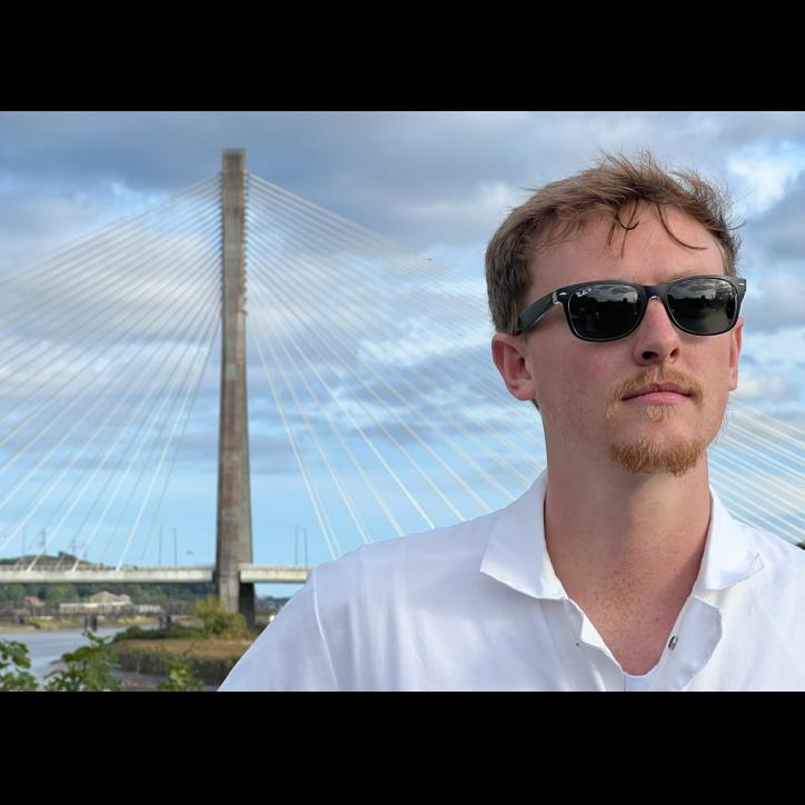 George Edwards reflecting on the trip so far, in front of the River Suir Bridge.