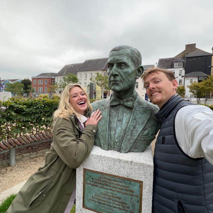 George and Emilee strike a pose with a well-weathered friend outside the Medieval Museum in Waterford. 