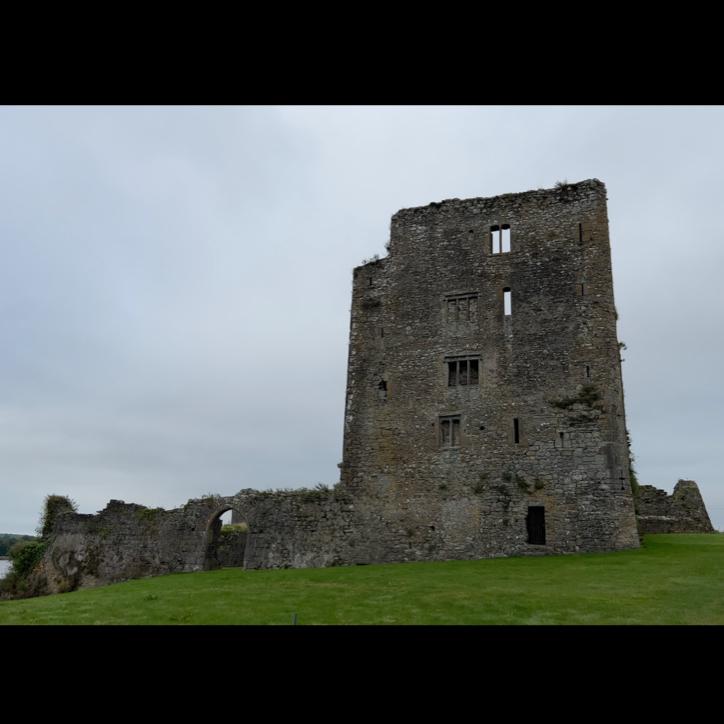 Grannagh Castle looking moody on a gray day.
