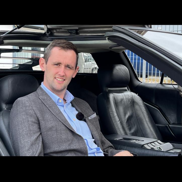 Steven Delaney, Managing Director of Q1 Scientific pops into the DeLorean.