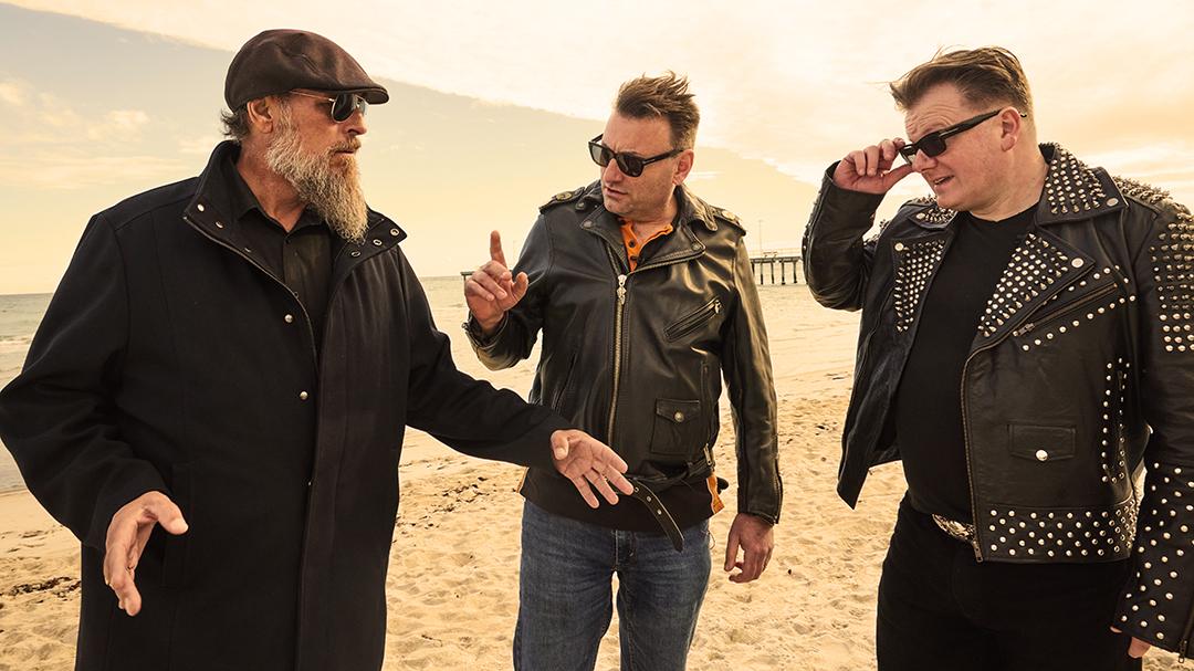 Clint, Rocco, and Nigel in deep conversation on the beach.