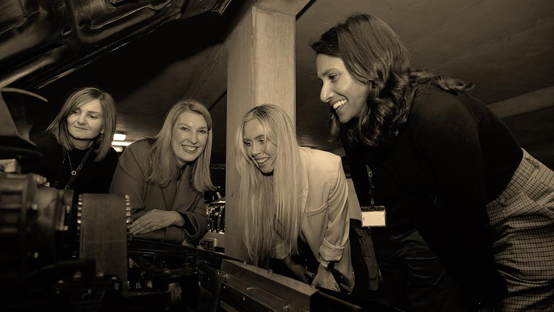 The ladies of Accelagen taking a closer look at what's under the Interceptor's hood.