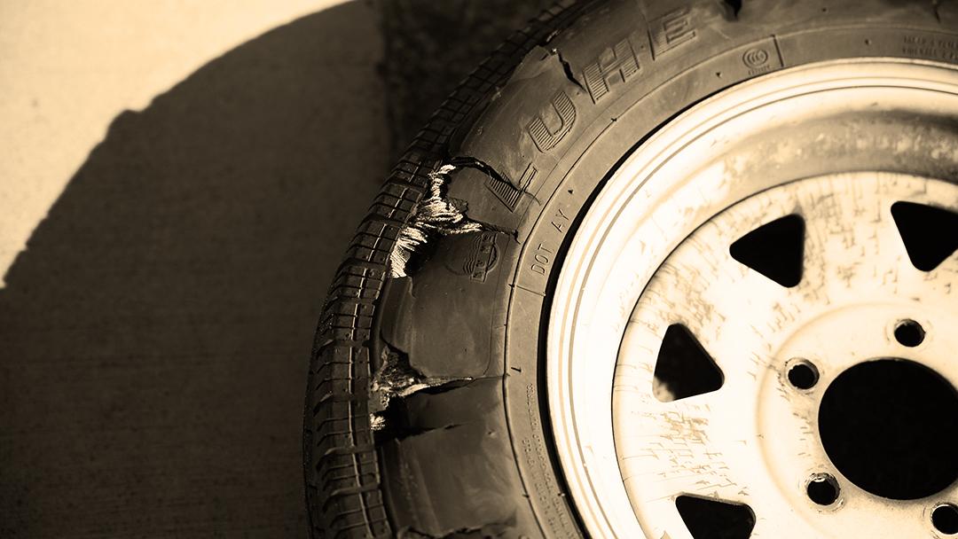We've blown a tire on our trailer.