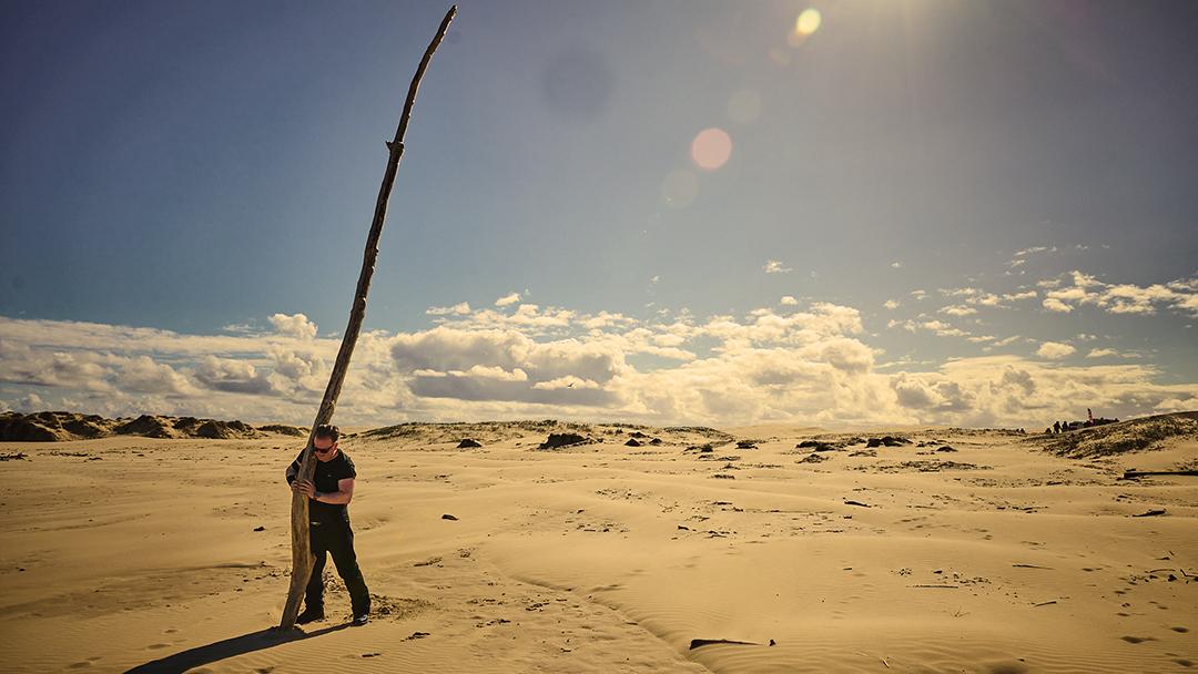 Holding up a branch at the end of the world.