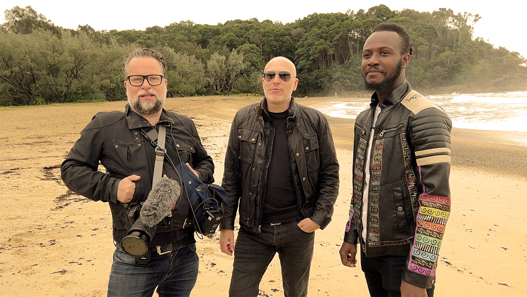 Mark, Phill, and Adama trying their best to stay dry.
