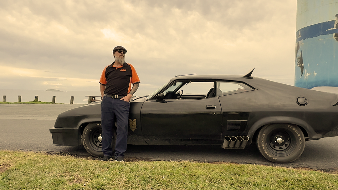Clint's keeping the car from floating away.