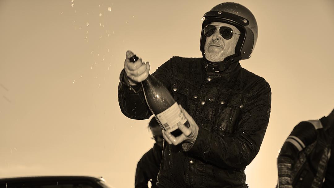 Phill "Goose" Neill popping the end-of-trip celebratory champagne.