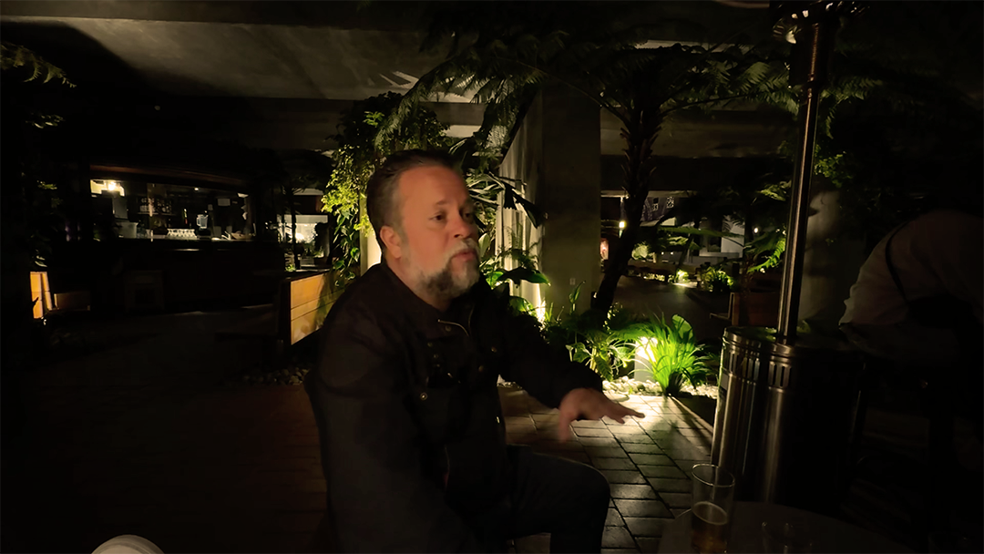 With the trip concluded, Mark is in desperate need of a stiff drink.